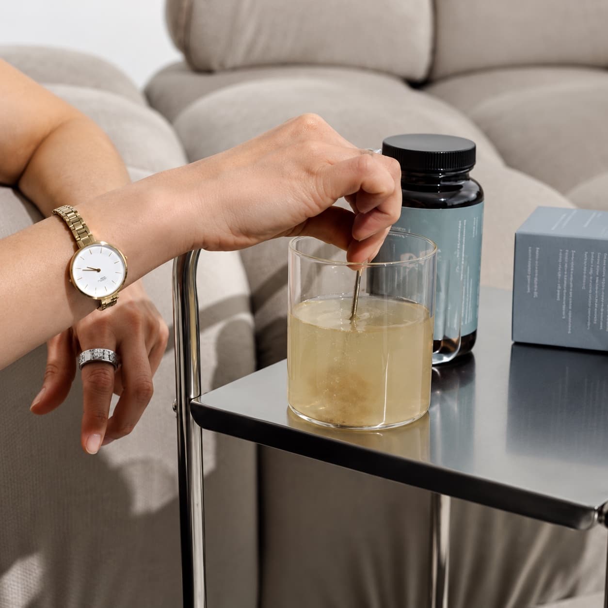 A supplement drink being stirred in a glass